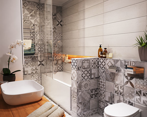 Скандинавские принты на кафельной плитке существенно разнообразят серый интерьер ванной.