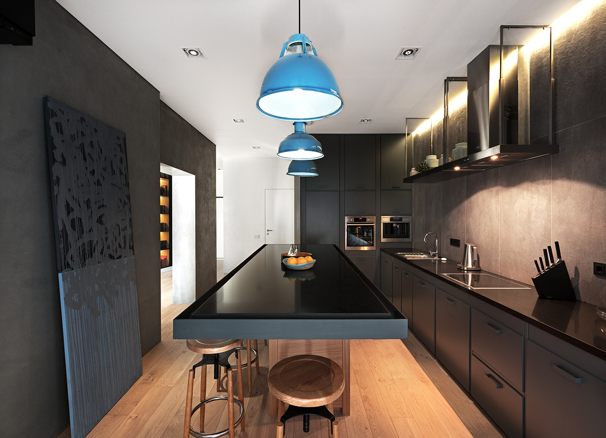 Большой кухонный стол из искусственного камня визуально расширяет пространство кухни.