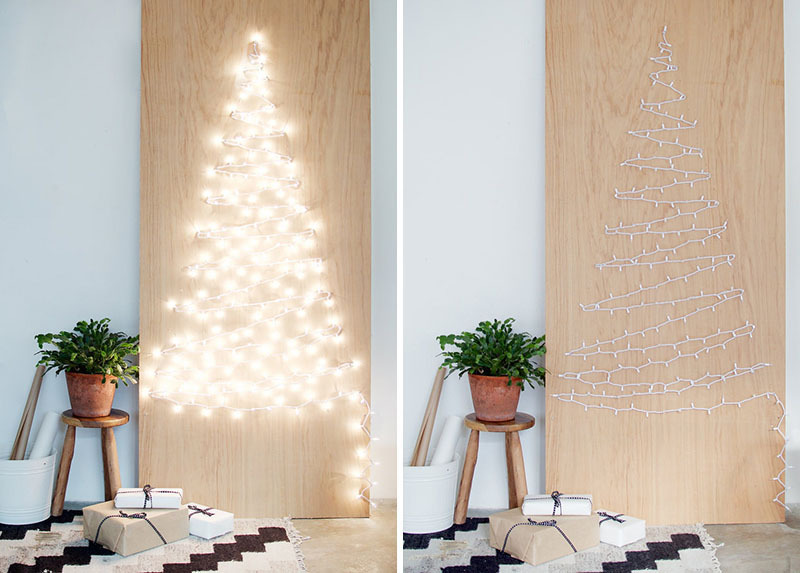 Один из самых простых вариантов плоской новогодней елки, который очень легко повторить. Светящаяся елочная гирлянда закреплена на листе фанеры в виде елочки. Когда гирлянда светиться, такая елочка выглядит очень эффектно.